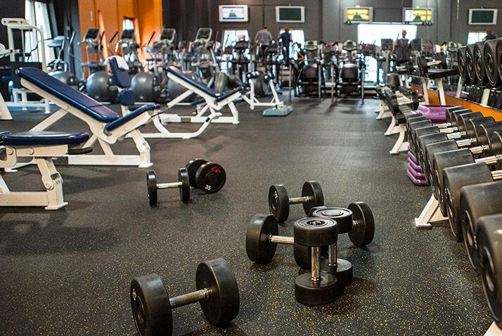 Runwave founders brainstorming clothing ideas in a gym, balancing work, life, and fitness for their Irish-owned brand